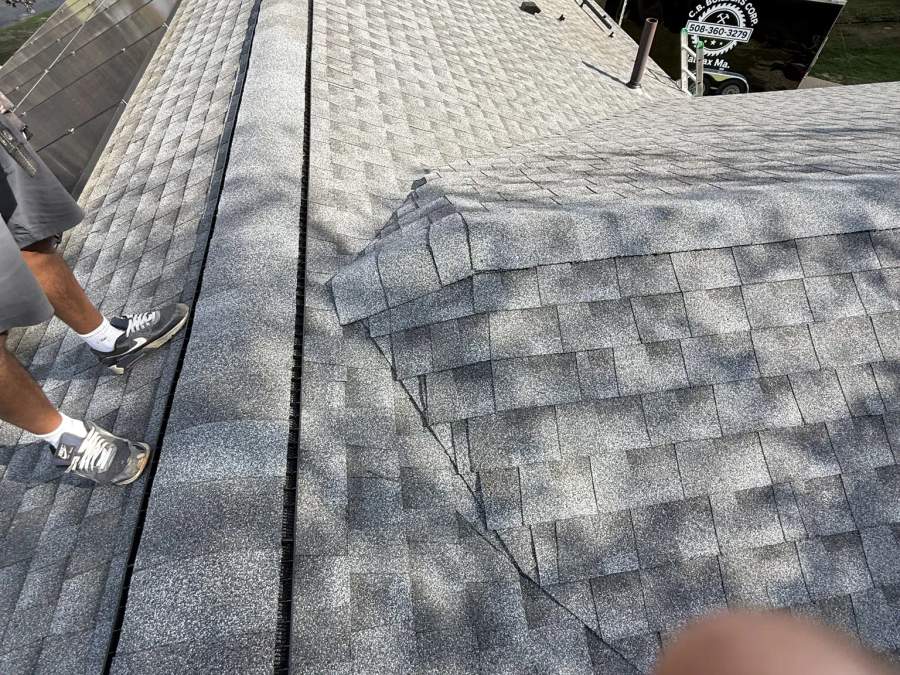 Finished architectural asphalt shingle roof ridge and adjoining roof planes by CB Builders Corp.