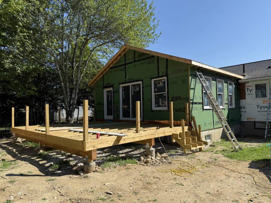 Home addition and connected deck framing under construction by CB Builders Corp. on the South Shore